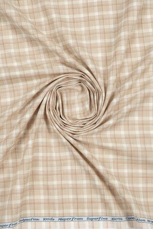 Beige Tresca cotton checks shirting fabric by Arvind, close-up of the textured unstitched fabric with check pattern.