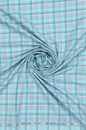 Blue and white checkered fabric with 'Tresca by Arvind' branding.