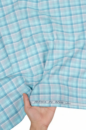 Blue and white checkered fabric with 'Tresca by Arvind' branding.