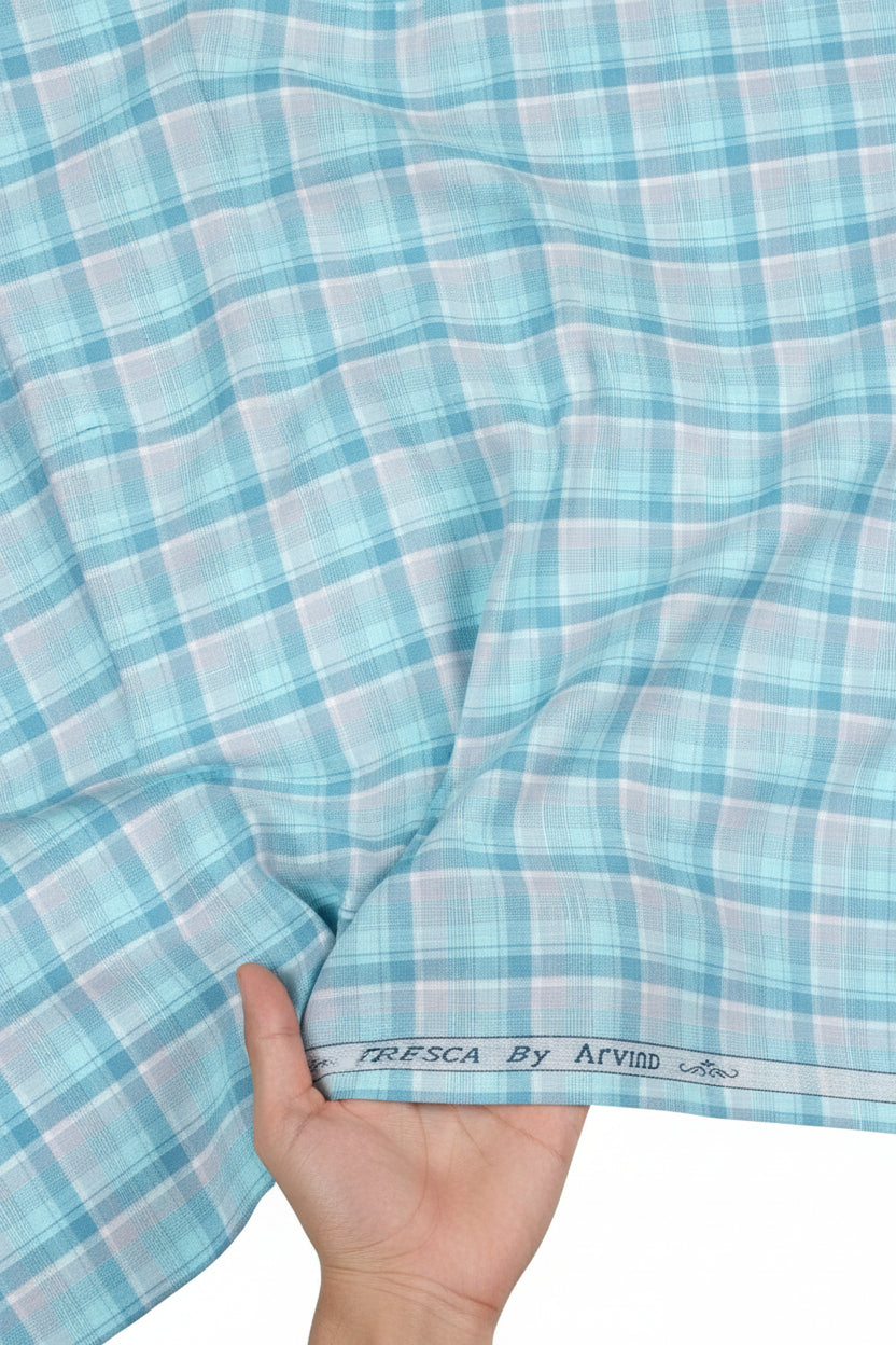 Blue and white checkered fabric with 'Tresca by Arvind' branding.