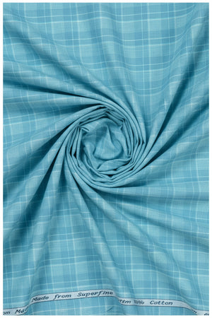 Clear blue Tresca cotton checks shirting fabric by Arvind, showcasing a soft, unstitched textile with a checkered pattern.