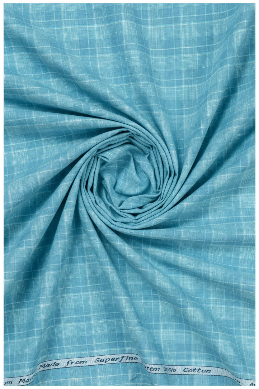 Clear blue Tresca cotton checks shirting fabric by Arvind, showcasing a soft, unstitched textile with a checkered pattern.