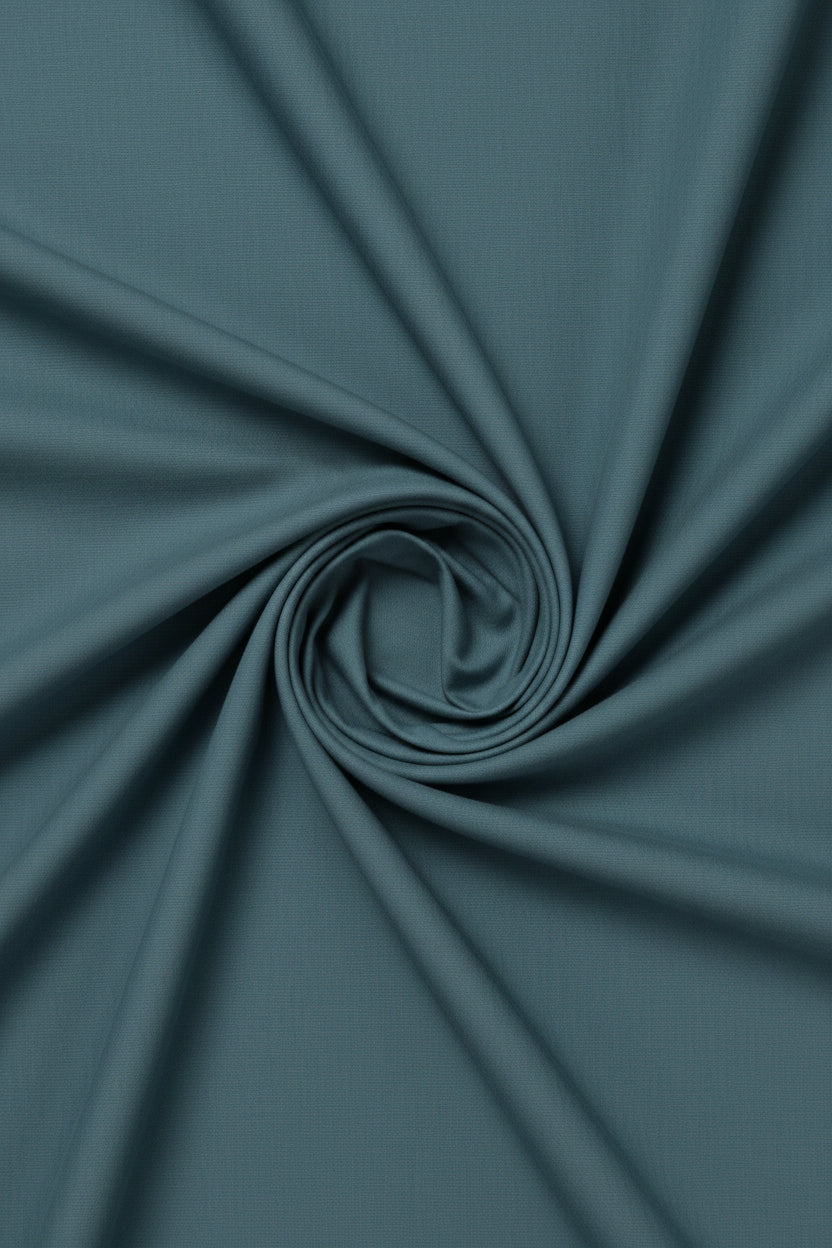 Light seagreen Arvind Tresca cotton plain shirting fabric with a smooth texture and subtle weave pattern.