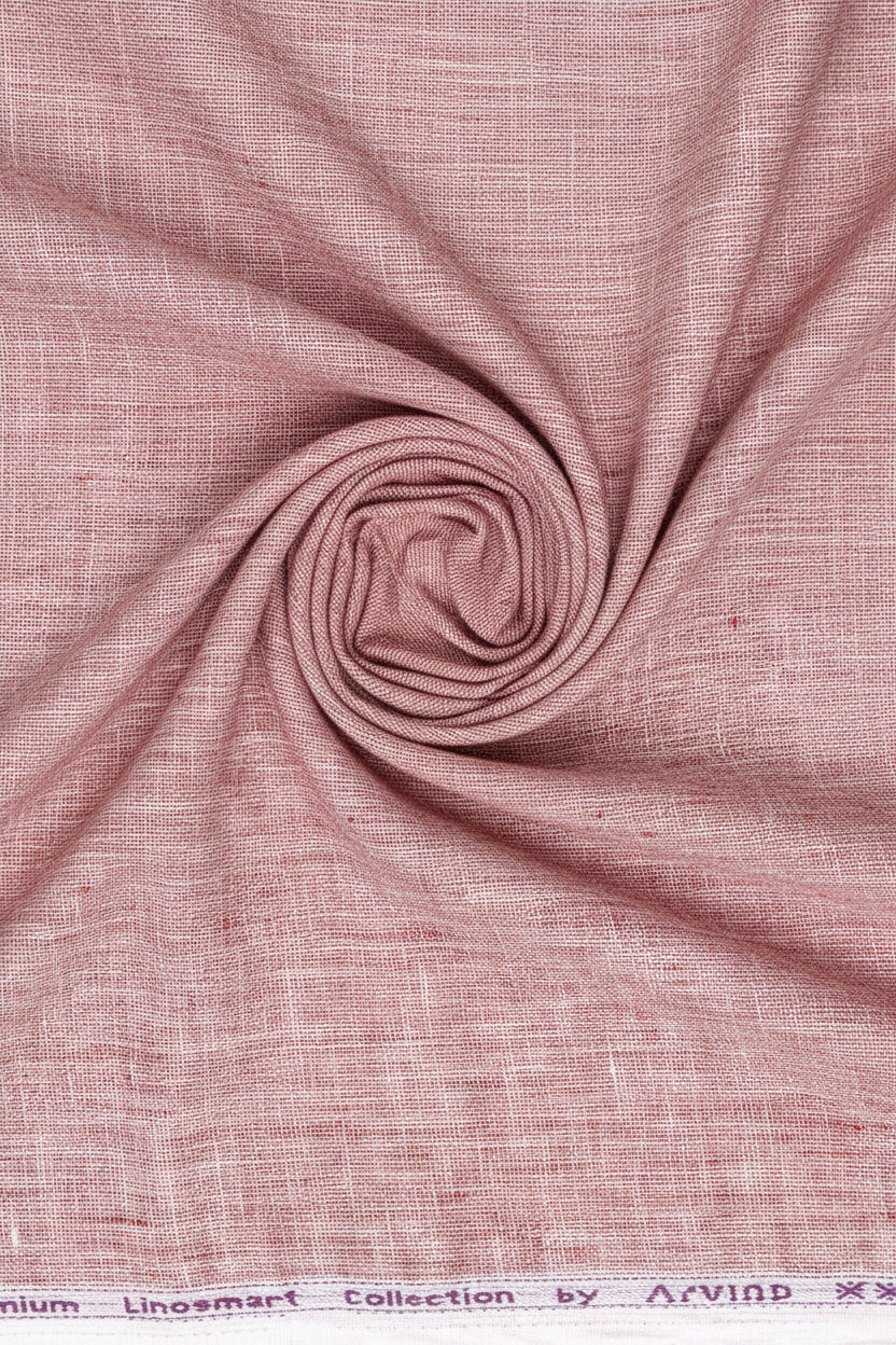 Light coral Arvind Tresca linen plain shirting fabric showcasing smooth, high-quality linen texture suitable for clothing.