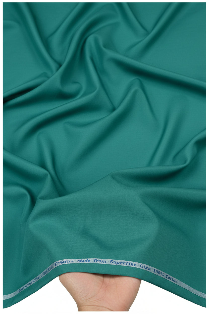 Teal green Arvind cotton shirt fabric with intricate woven pattern, ideal for making stylish shirts or traditional garments.