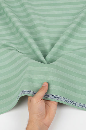 Green fabric with a subtle pattern and label at the top