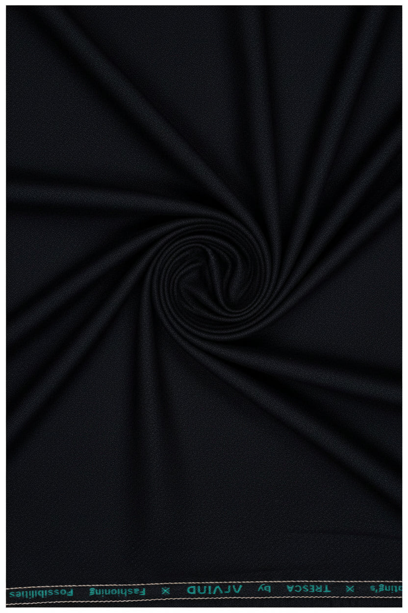 Black Raymond Arvind poly viscose trousers and suiting fabric, showing the fabric texture and garment detail.