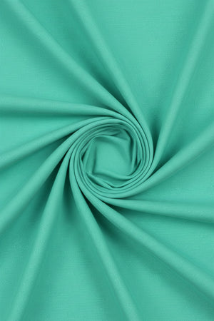 Neon green Arvind Tresca cotton unstitched shirting fabric shown in a close-up image with smooth texture and vibrant color.