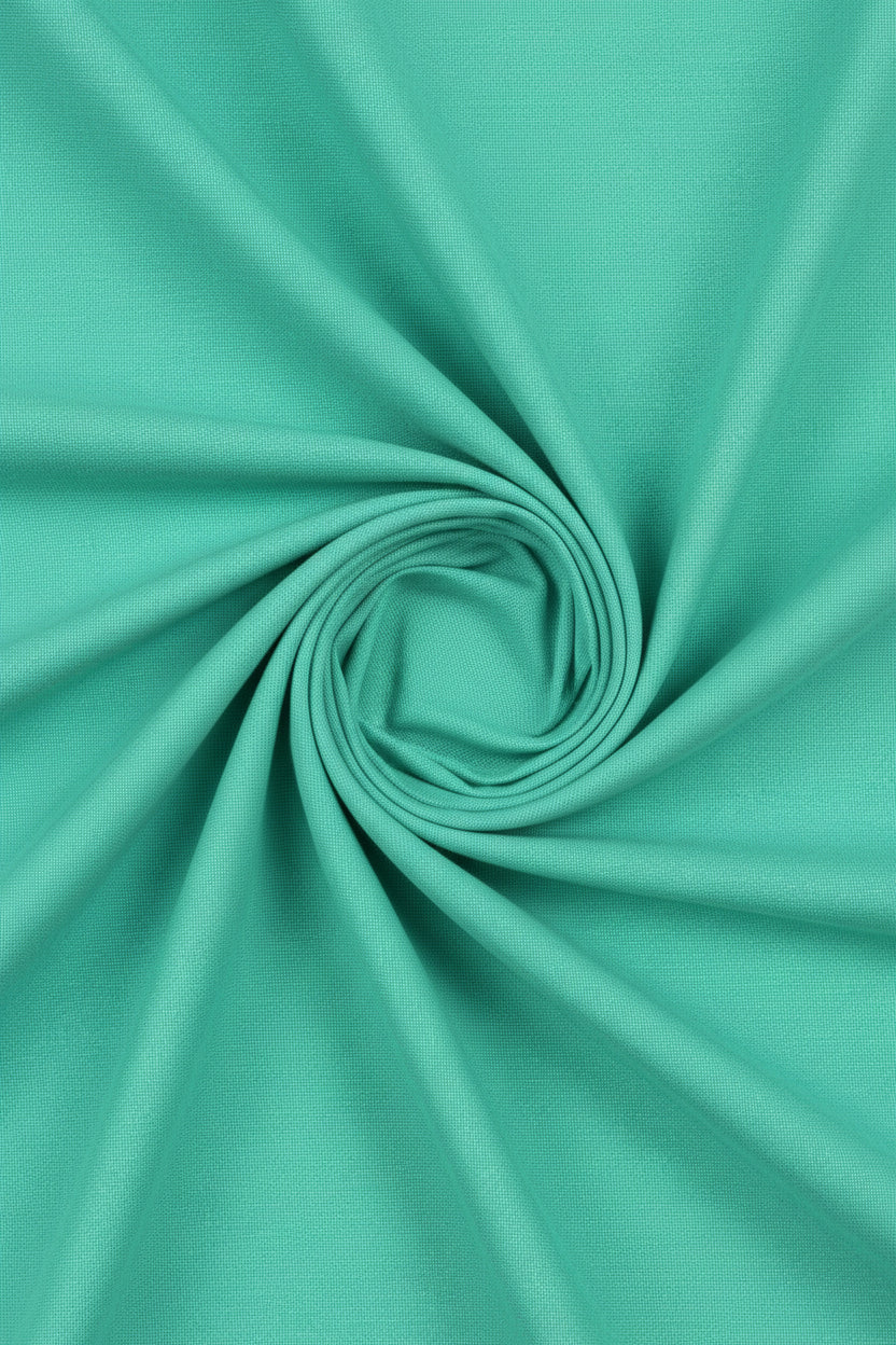 Neon green Arvind Tresca cotton unstitched shirting fabric shown in a close-up image with smooth texture and vibrant color.