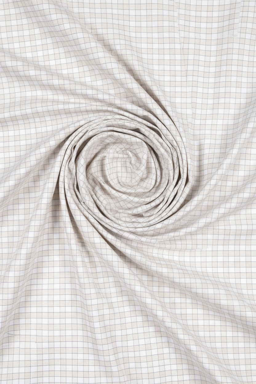 Beige Tresca cotton checks shirting fabric by Arvind, showcasing a close-up of the textured check pattern and fabric weave.