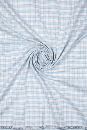 White and blue Arvind Checks Tresca cotton shirting fabric with a checkered pattern, ideal for shirts and dressmaking.