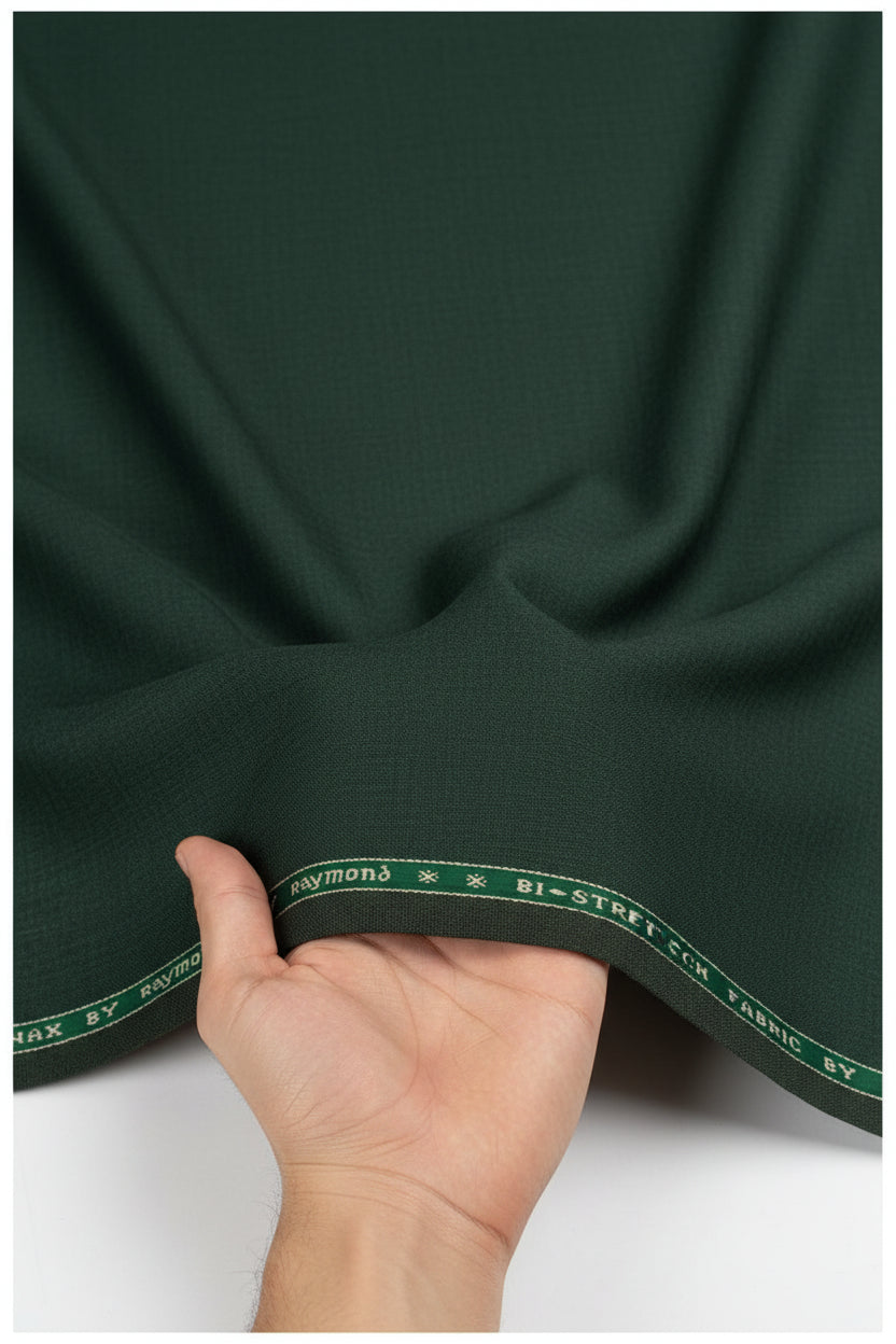 Raymond polywool trousers and suiting fabric in seaweed green with Lycra stretch, showing fabric texture and color detail.