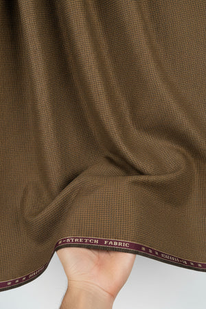 Brown Raymond Polywool Lycra stretchable fabric for trousers and suiting, featuring a smooth woven texture and flexible fit.