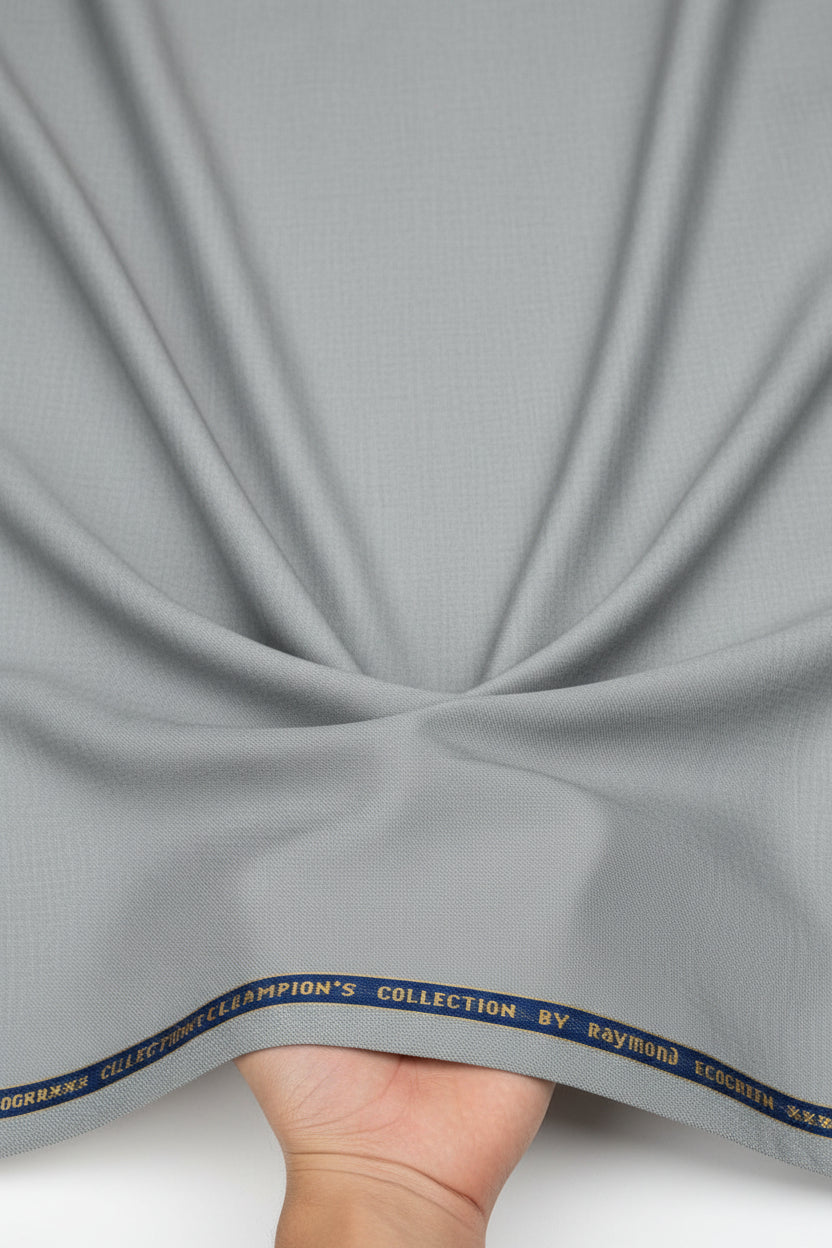 Gray Raymond polywool trousers and suiting fabric featuring a premium wool blend, displayed in a close-up texture shot.
