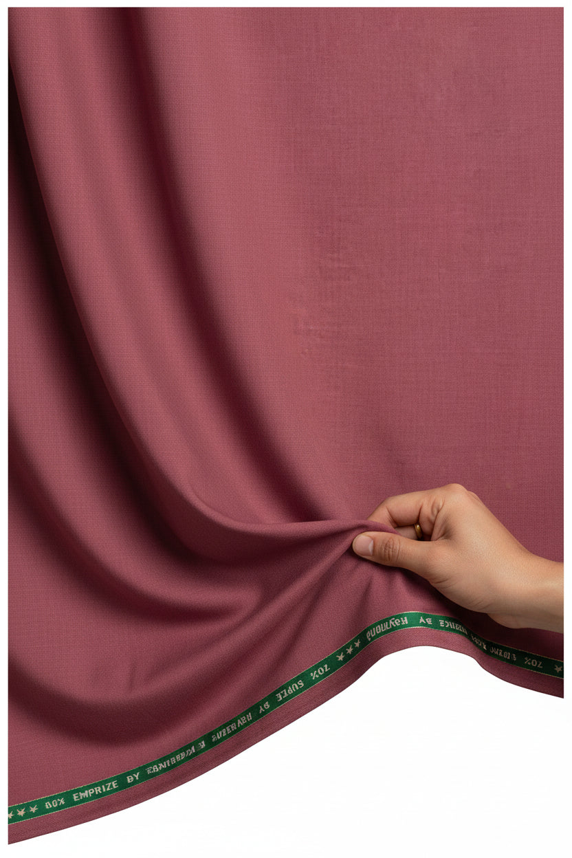 Raymond unstitched super 120’s polywool trousers and maroon pink suiting fabric, showing smooth textured material and rich color.