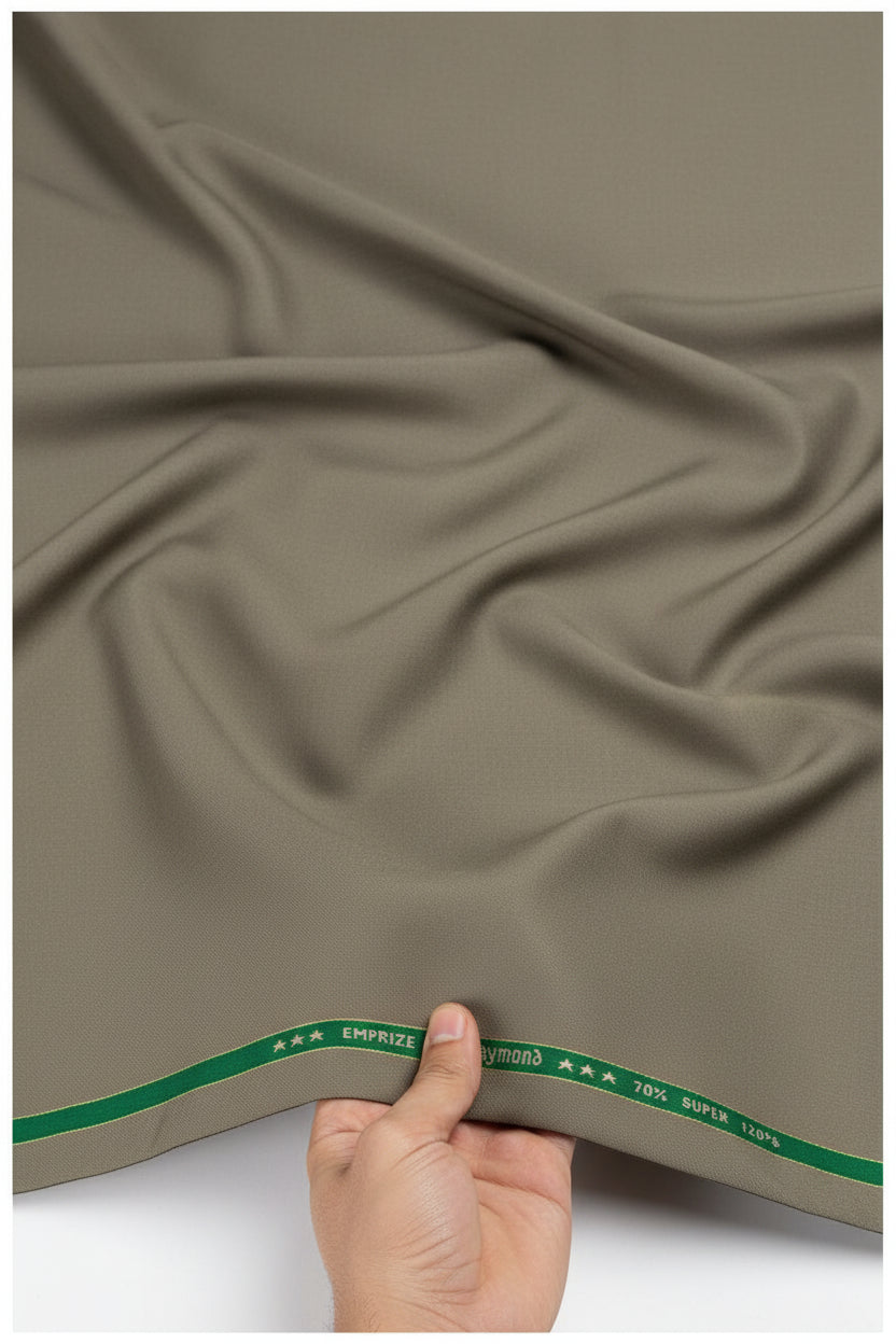 Olive khaki Raymond unstitched super 120’s polywool trousers and suiting fabric, detailed close-up of textured fabric material.