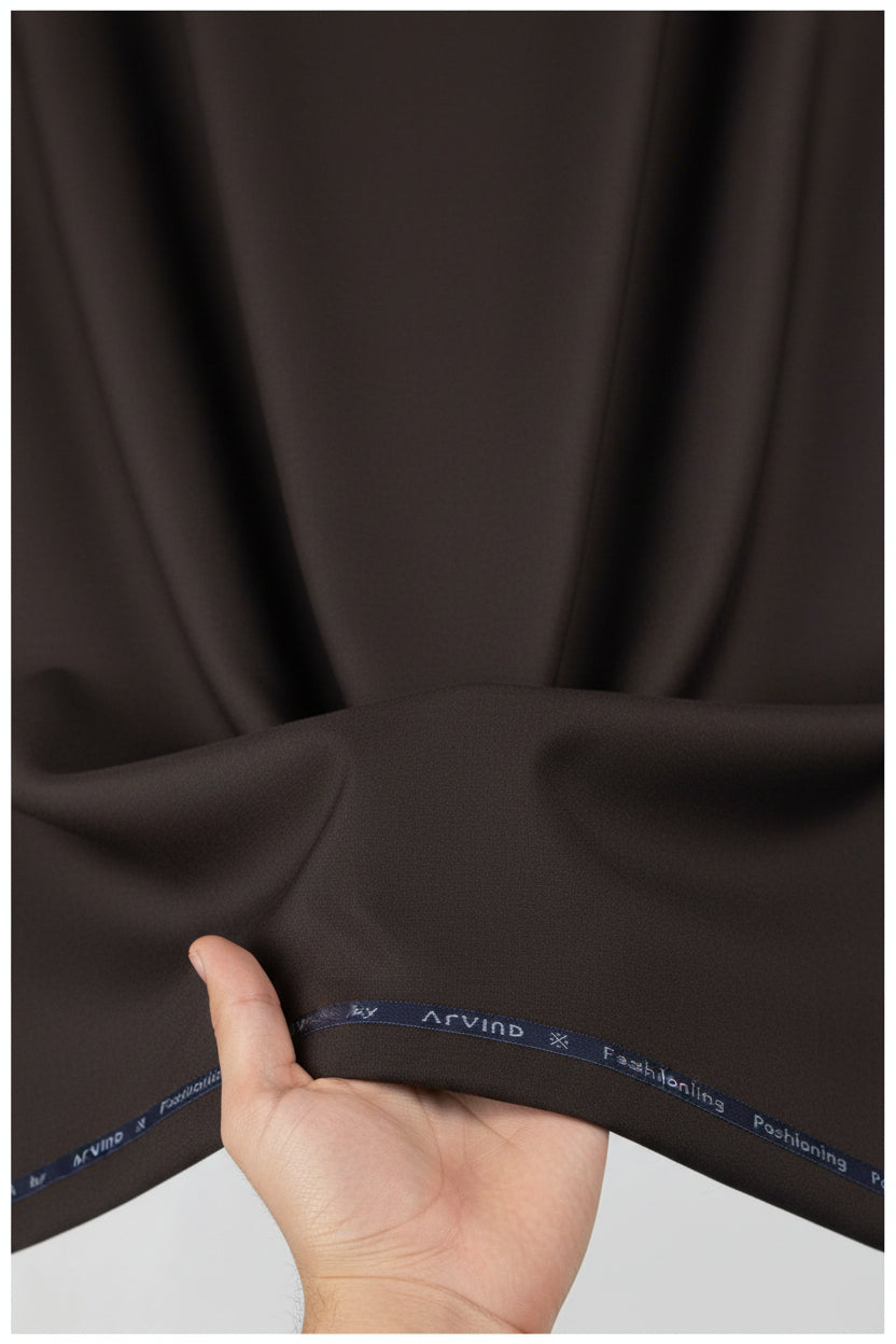 Brown Arvind Lycra stretchable trouser and suiting fabric with a smooth texture, suitable for tailored apparel and formal wear.