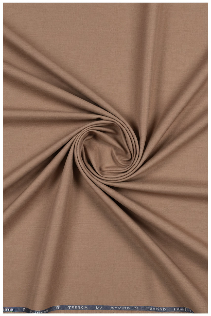 Brown Arvind cotton Lycra stretchable trouser and suiting fabric, showing a close-up of the soft, flexible textile material.