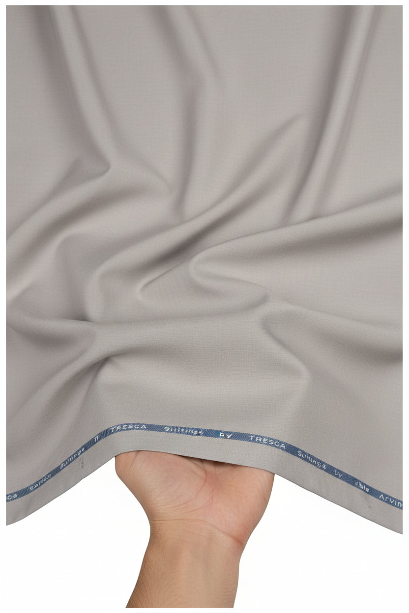 Steel grey Arvind cotton Lycra stretchable trouser and suiting fabric, showing its smooth, flexible textile texture and fabric pattern.