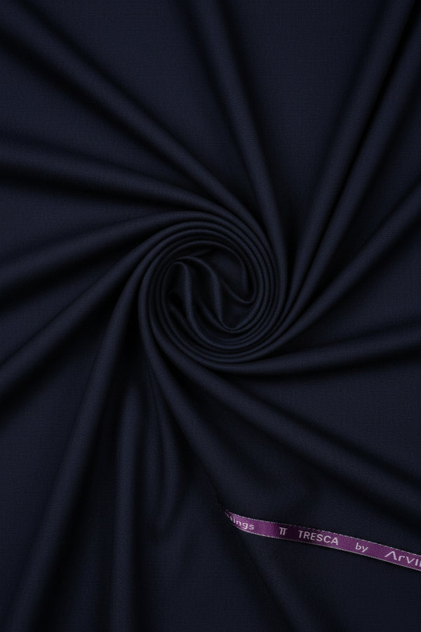 Plum purple Arvind Terry Rayon Suiting fabric displayed, showing soft texture and woven pattern for traditional or modern garments.