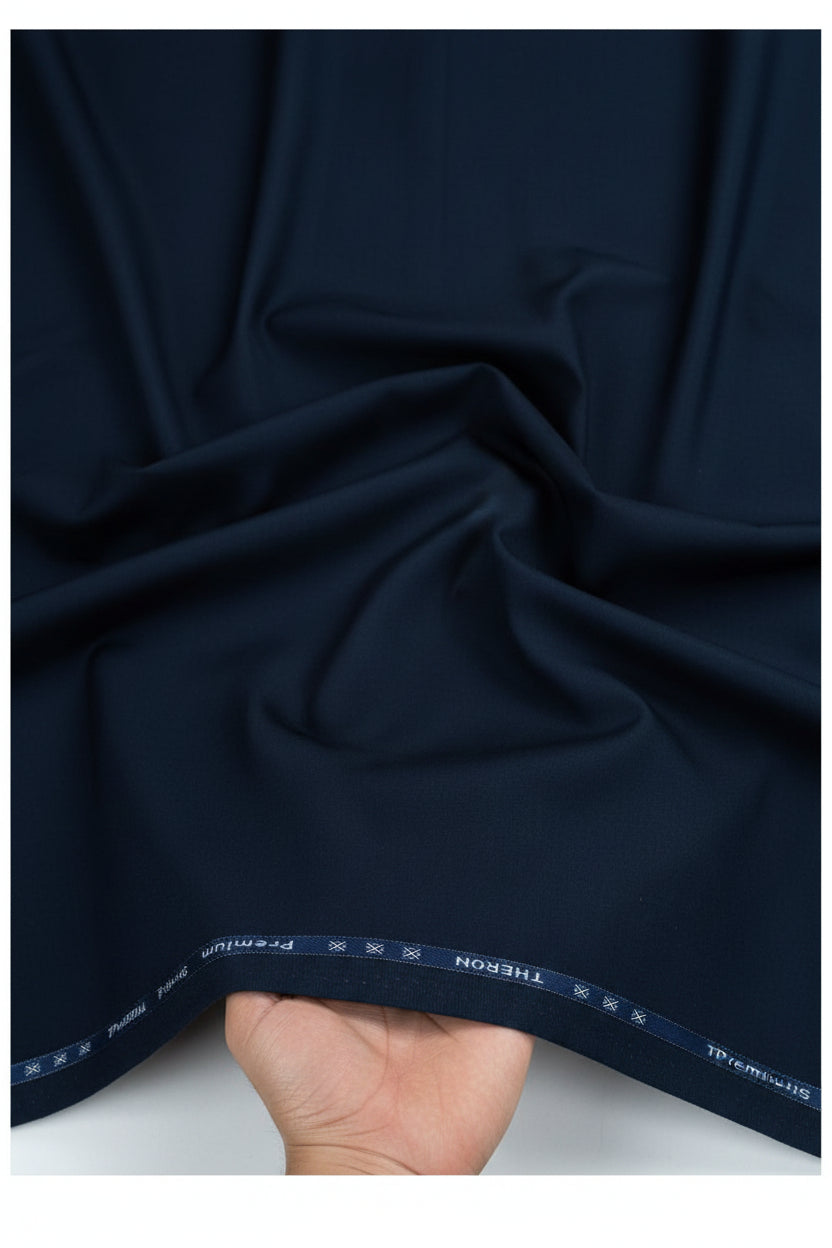 Navy blue Arvind cotton lycra trouser and suiting fabric, smooth woven textile with subtle texture, ideal for tailored garments.