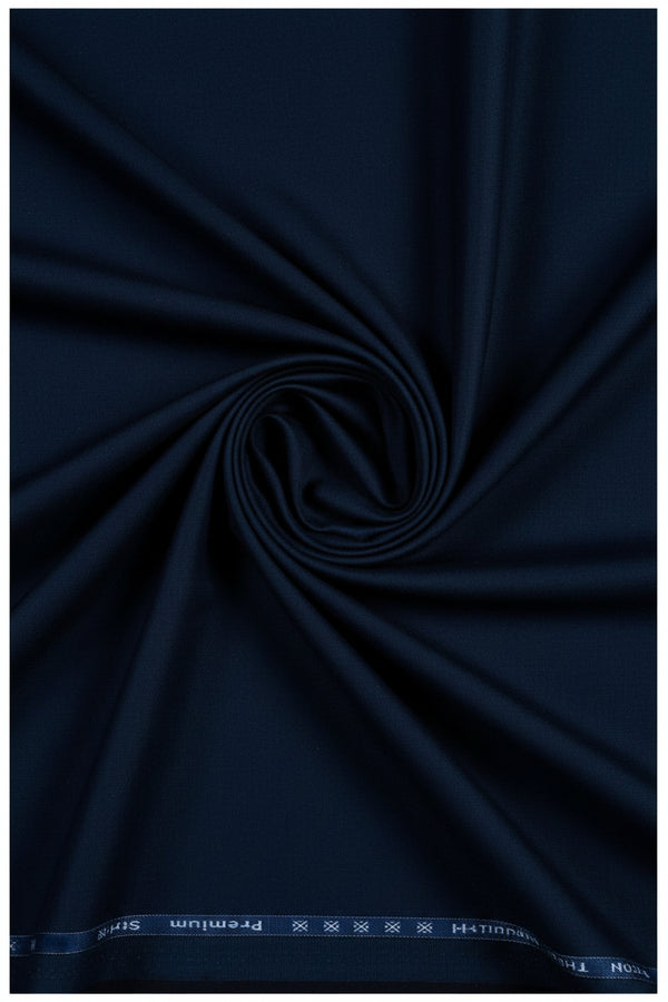 Navy blue Arvind cotton lycra trouser and suiting fabric swatch with textured weave and fabric details.