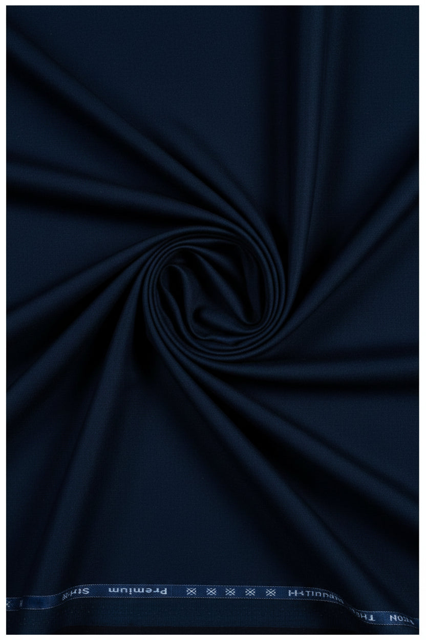 Navy blue Arvind Cotton Lycra trouser and suiting fabric with a smooth texture and subtle sheen, ideal for tailored garments.