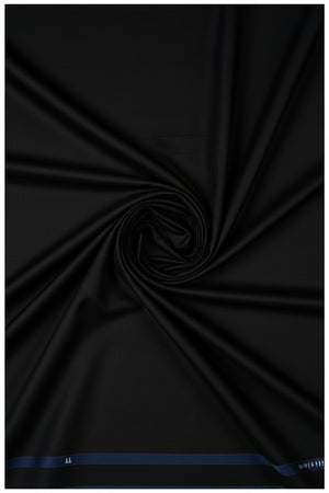 Black Arvind cotton lycra stretchable trouser and suiting fabric, showing smooth fabric with a slight sheen and flexible texture.