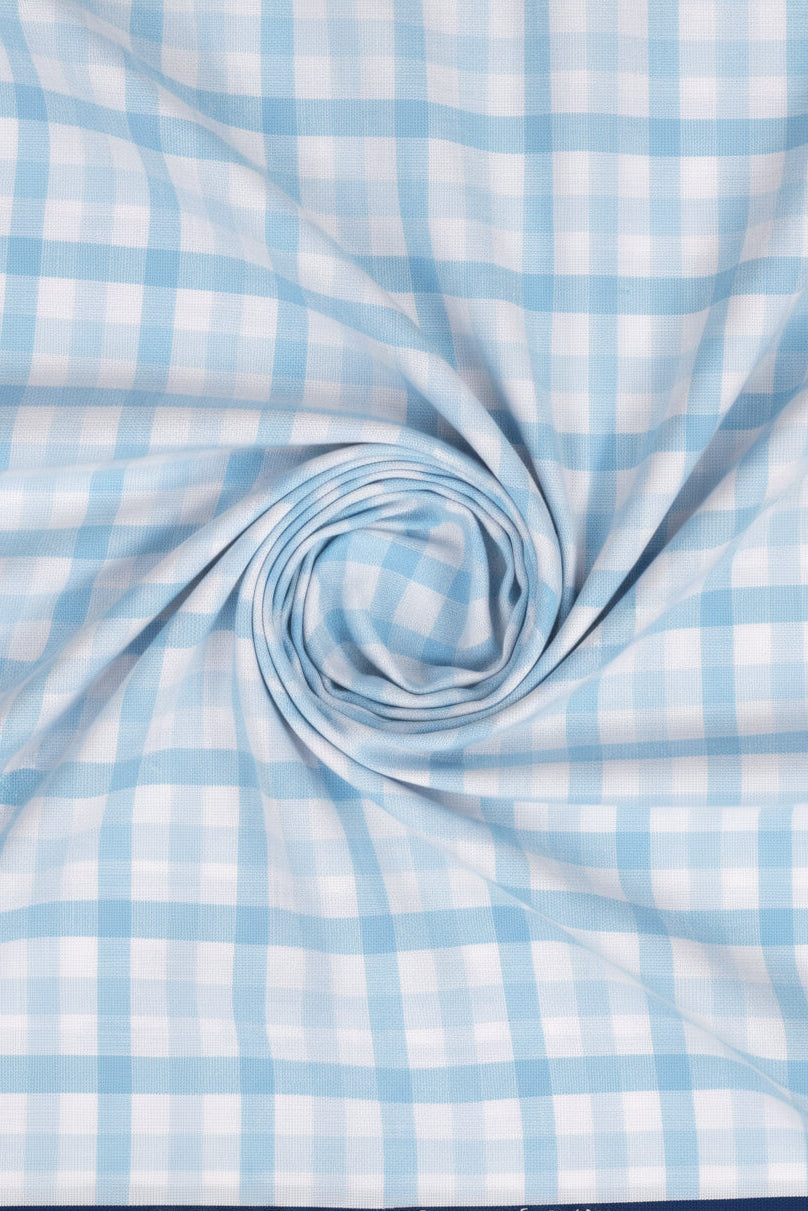 Sky blue Arvind cotton checks shirting fabric, unstitched material for shirts, featuring a classic check pattern and soft cotton texture.