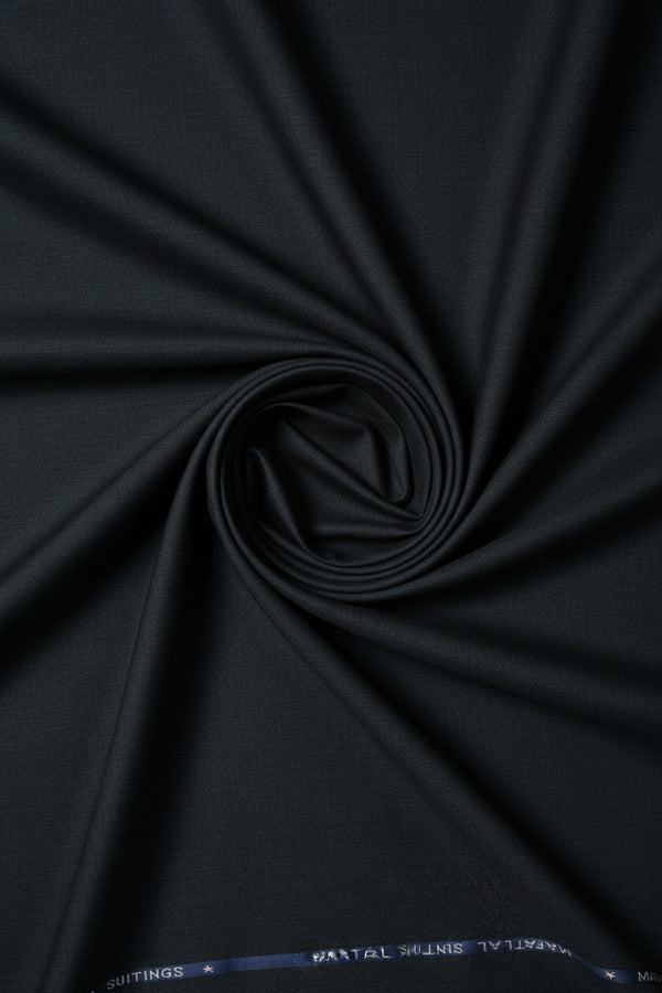 Charcoal grey Mafatlal poly viscose suiting fabric with a smooth texture, suitable for formal garments or tailoring.