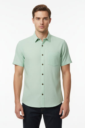 Pista green Arvind Tresca Giza cotton shirting fabric with a smooth texture and subtle sheen, suitable for stylish dress shirts.