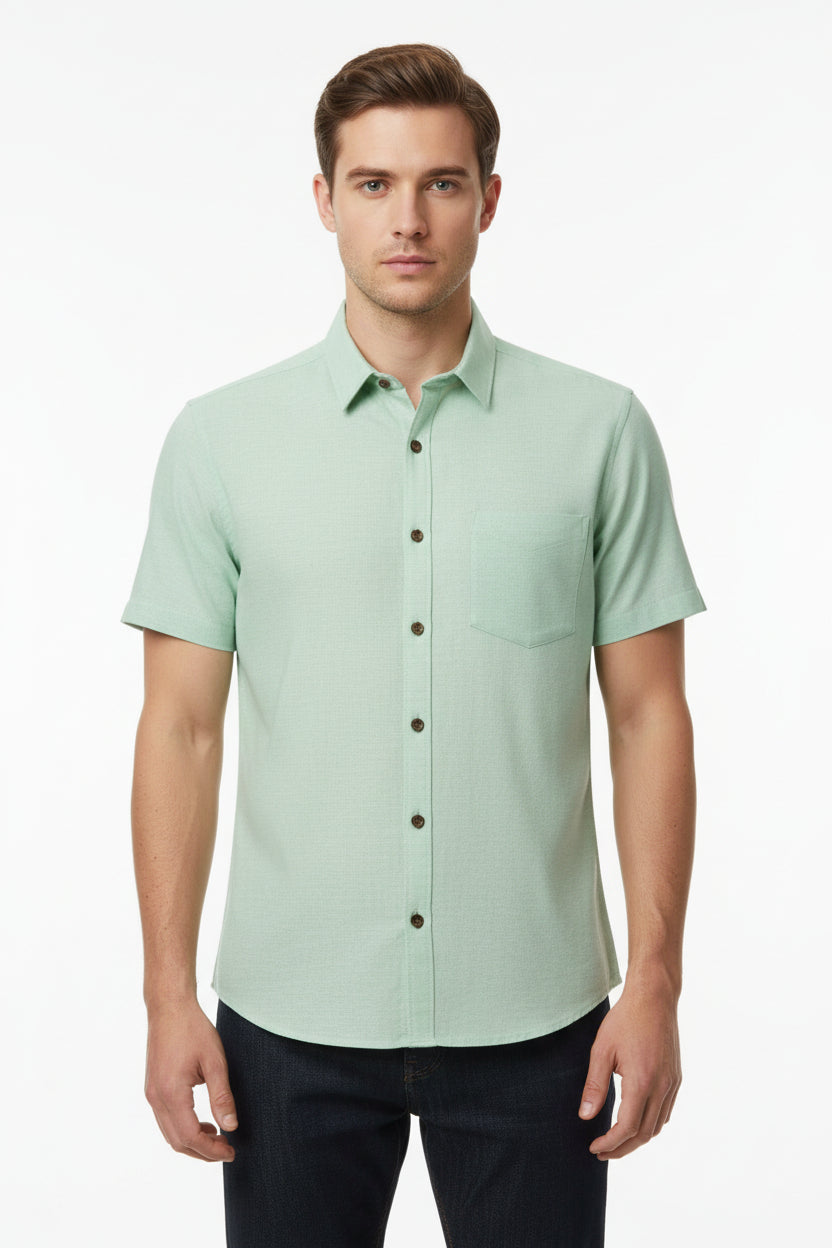 Pista green Arvind Tresca Giza cotton shirting fabric with a smooth texture and subtle sheen, suitable for stylish dress shirts.