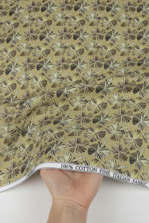 Fabric swatch with a floral pattern on a beige background