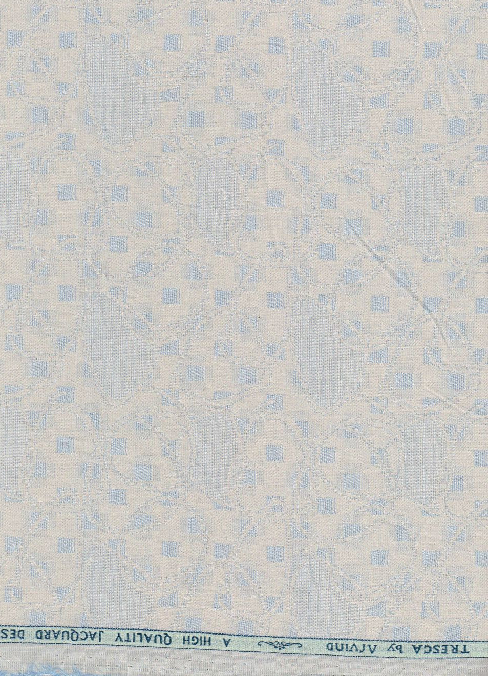 Golden Arvind Tresca cotton jacquard shirting fabric, textured unstitched textile with intricate woven pattern.