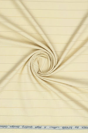 Yellow striped Arvind Tresca Giza cotton shirt fabric with a smooth, woven texture and vibrant pattern.
