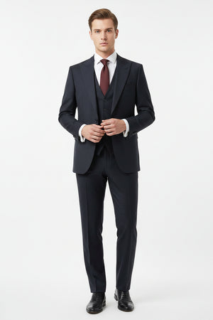 Georgia Gullini Italy shadow grey poly wool Super 130’s fabric for trousers and suiting, showing a close-up of the high-quality material.