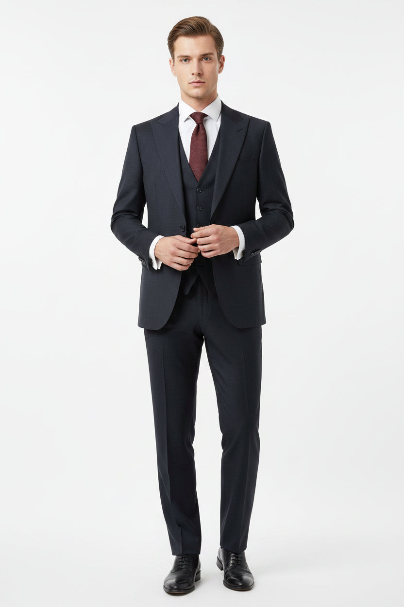 Georgia Gullini Italy shadow grey poly wool Super 130’s fabric for trousers and suiting, showing a close-up of the high-quality material.