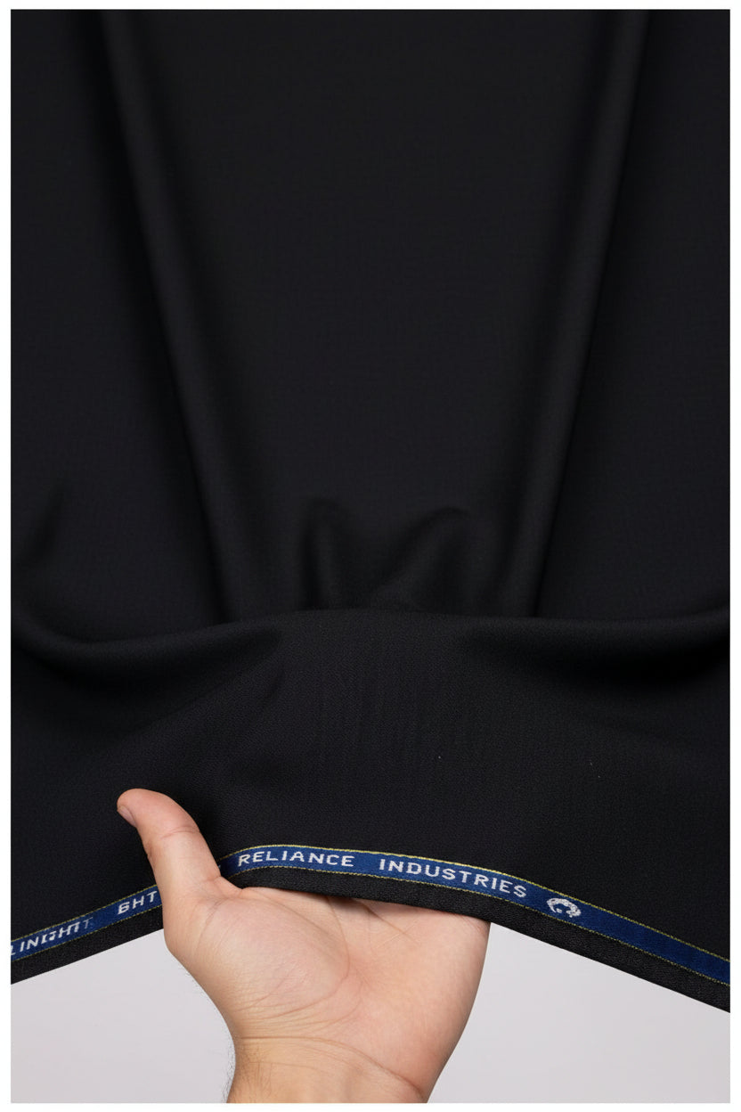 Georgia Gullini of Italy Polywool Super 110’s trousers fabric in coffee, showing a close-up of the premium wool blend textile.