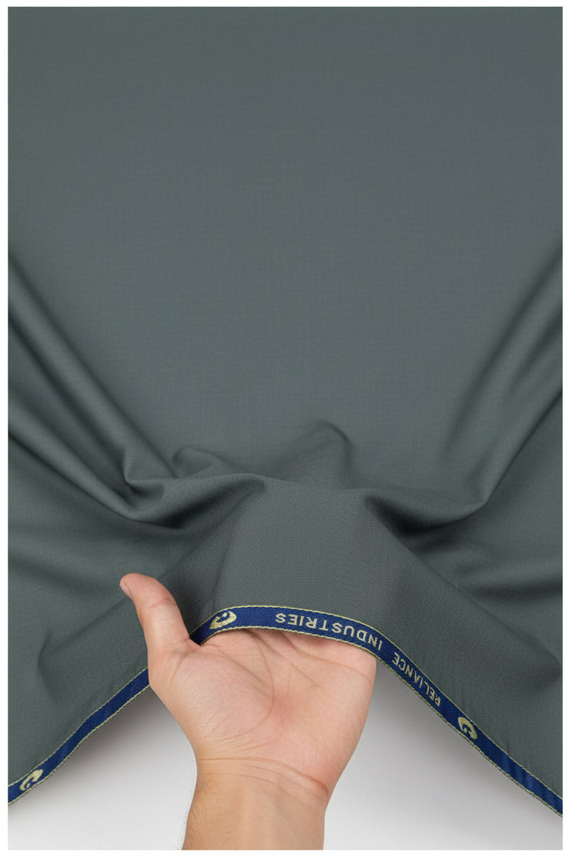 Georgia Gullini Italy Super 100’s poly wool suit fabric in steel armor color, close-up of textured woven textile for trousers and suiting.