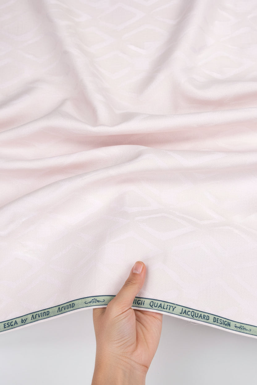 Pink Arvind Tresca Jacquard unstitched shirting fabric, detailed woven pattern, suitable for custom shirts and dressmaking.