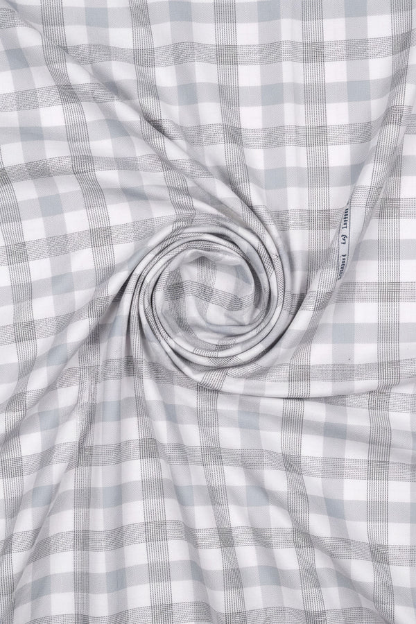 Grey and white checkered Arvind Tresca shirt fabric made of premium cotton, shown in close-up with detailed texture.