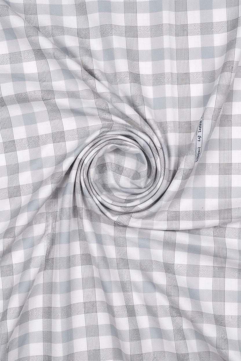 Plaid fabric pattern with gray and white colors, brand 'Tresca' visible.