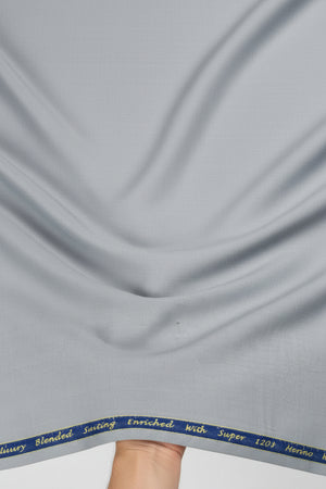 Grey Georgia Gullini of Italy Polywool Super 120’s fabric for trousers and suiting, showing the textured woven textile.