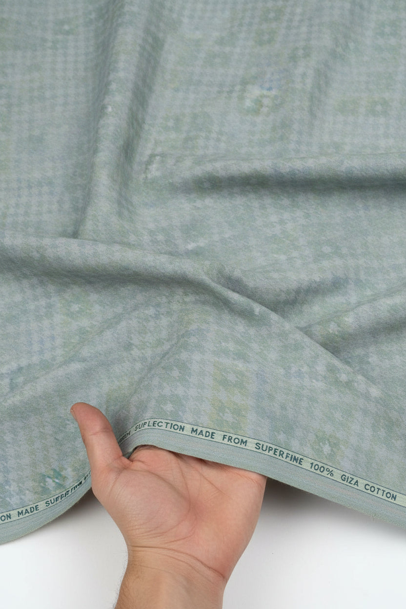 Green multicolor Arvind Tresca shirt fabric made from Giza cotton, showcasing a detailed pattern and soft texture.