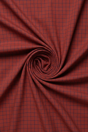 Red and blue check Arvind linen shirt fabric with a woven pattern, showcasing a lightweight, breathable textile ideal for shirts.