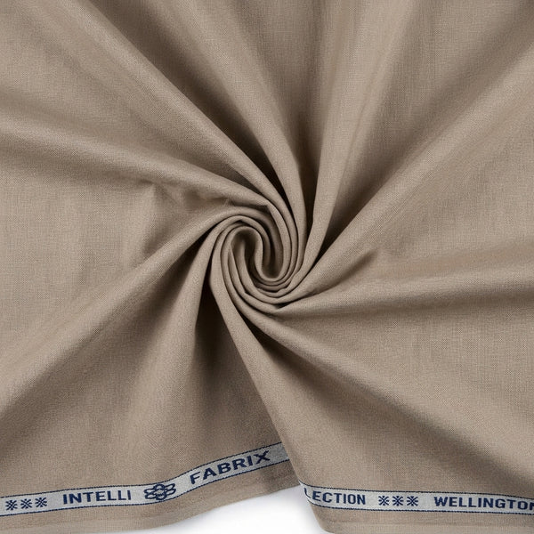 Cotton Lycra Arvind suit fabric in neutral tan with a swirl pattern, showcasing soft, stretchy textile for elegant traditional wear.