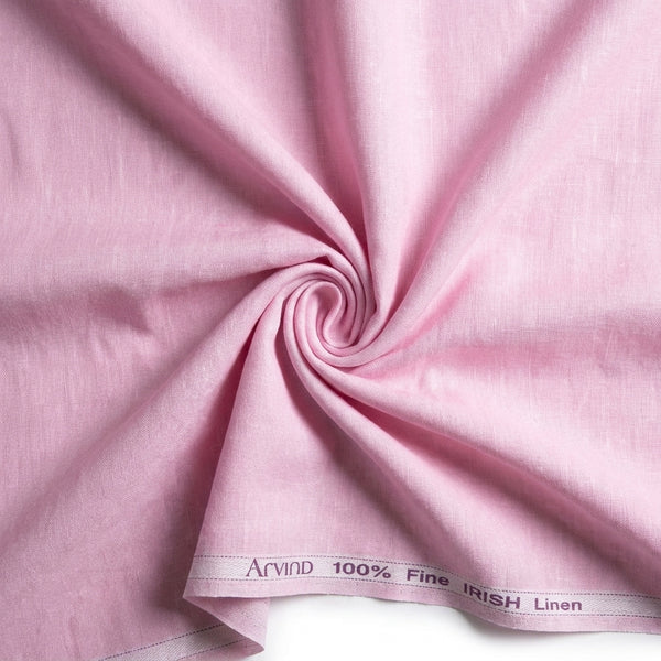 Pink Arvind pure linen shirt fabric swatch, unstitched textile with a smooth, lightweight linen texture for sewing or crafting.
