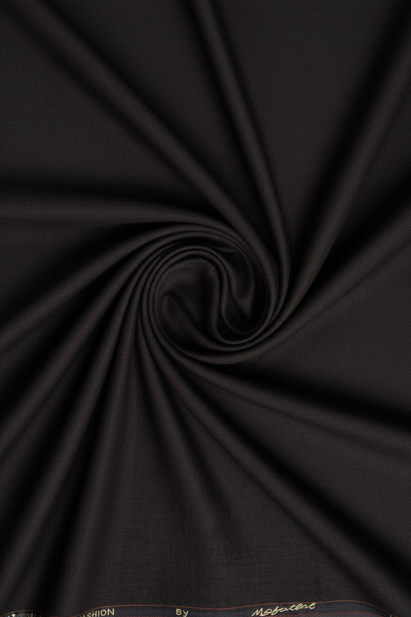 Brown Mafatlal poly viscose trouser and suiting fabric, close-up of textured fabric showing the material's weave.