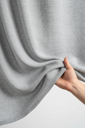 Grey Mafatlal unstitched cotton trousers and suiting fabric fabric with a smooth texture and fabric pattern.
