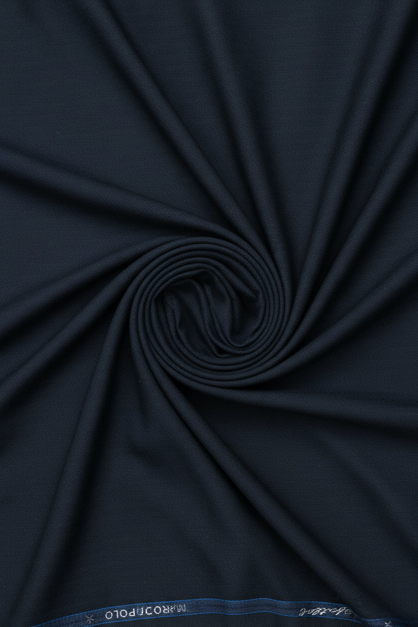 Dark slate blue unstitched poly wool trouser and suiting fabric by Mafatlal, showing textured fabric swatch.